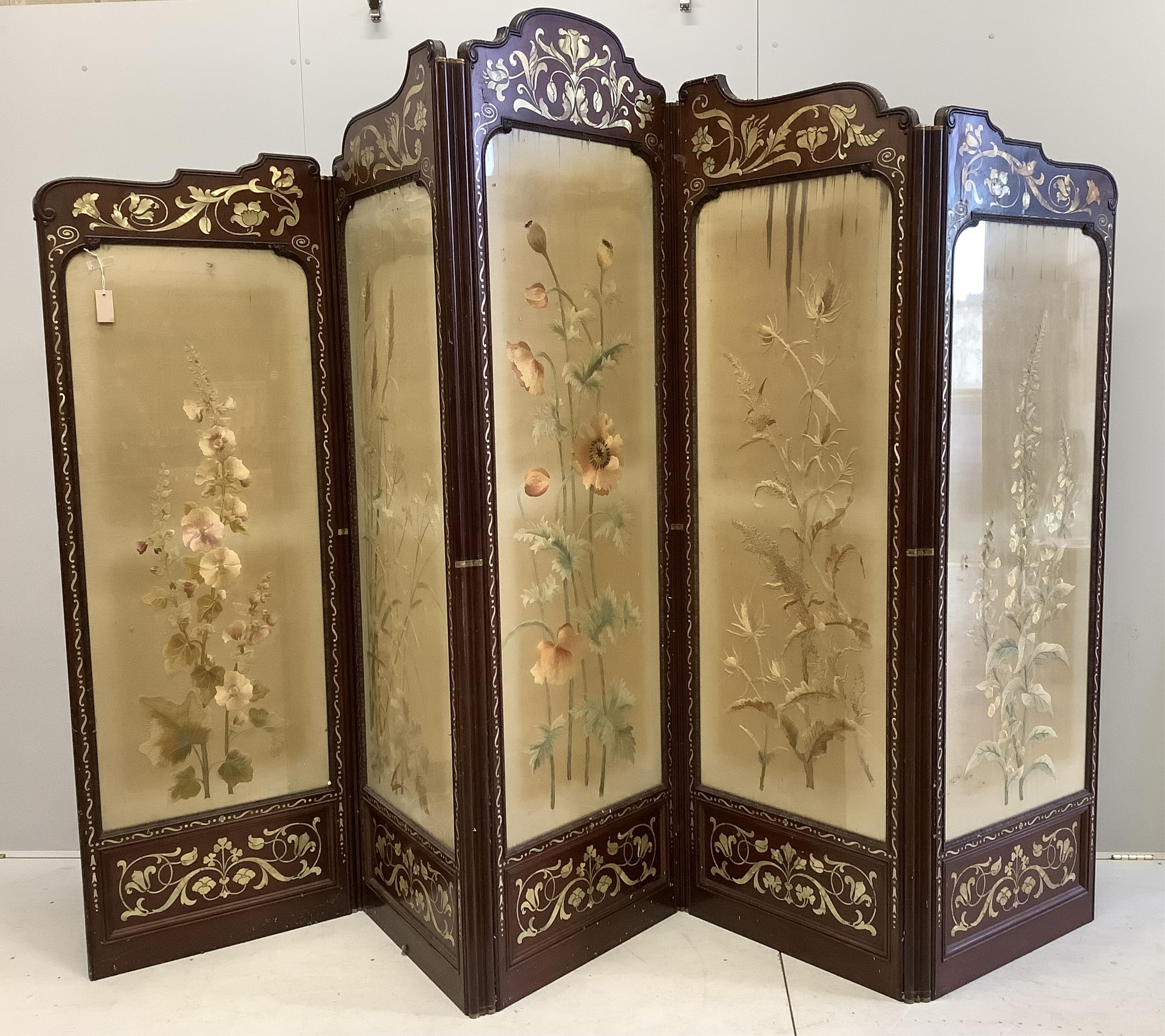 An Art Nouveau mother of pearl inlaid five fold screen, inset silk thread embroidered panels, largest panel width 64cm, height 213cm. Condition - fair to good, one panel poor